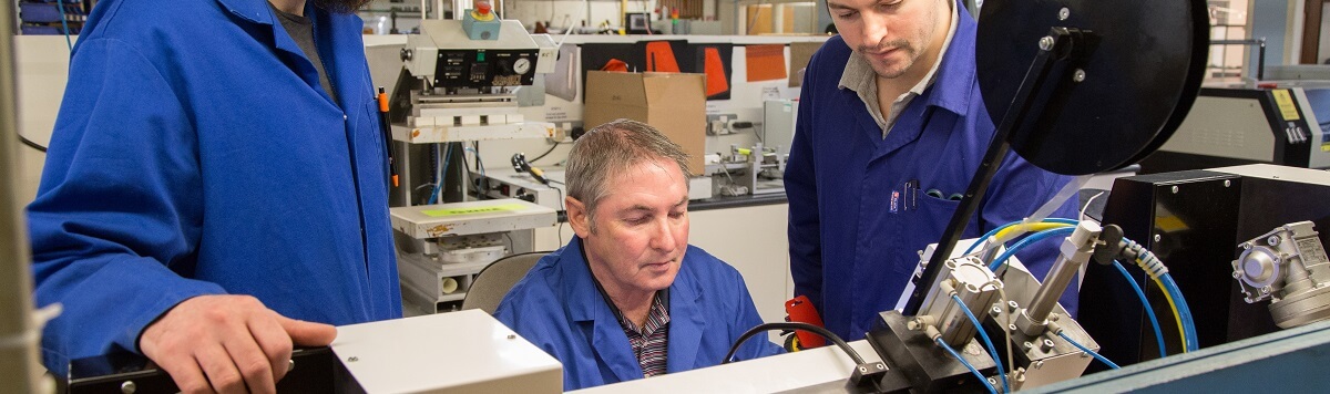 our engineers making some development changes to a seam sealing machine in our factory